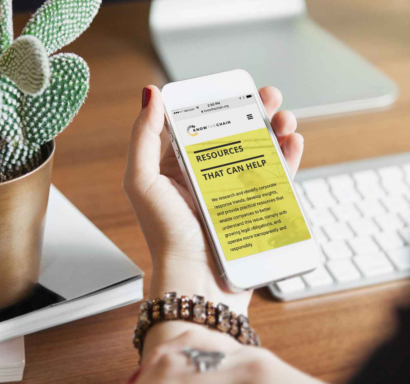A close up of someone looking at the new website on a mobile phone