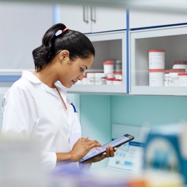 Scientist woman using digital tablet in hospital