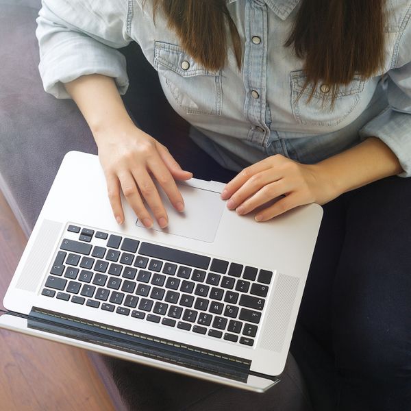 Woman working on laptop at home