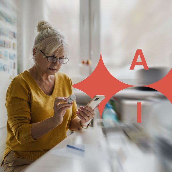 Older woman checking prescription with cell phone